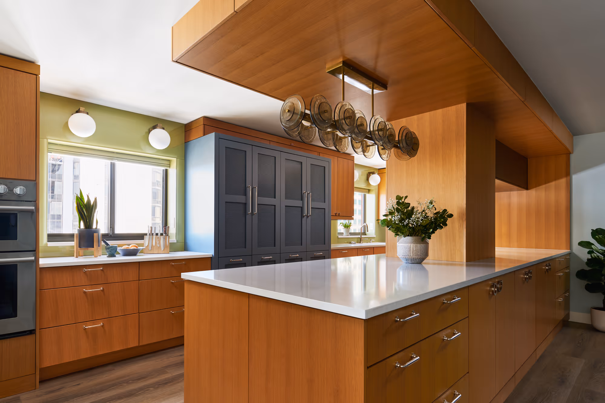 Modern kitchen remodel in Denver high rise condo with wooden cabinetry