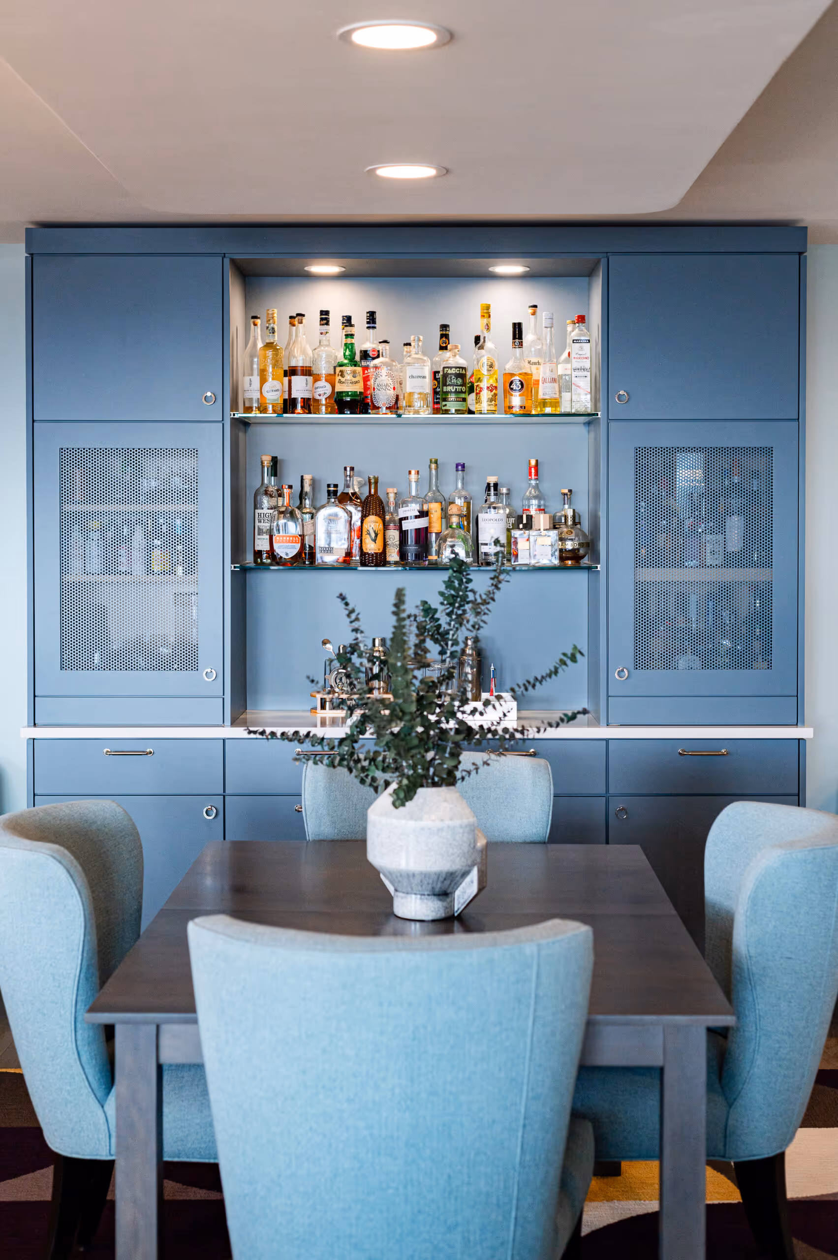 Custom cabinetry around HVAC unit designed to resemble a built-in refrigerator 