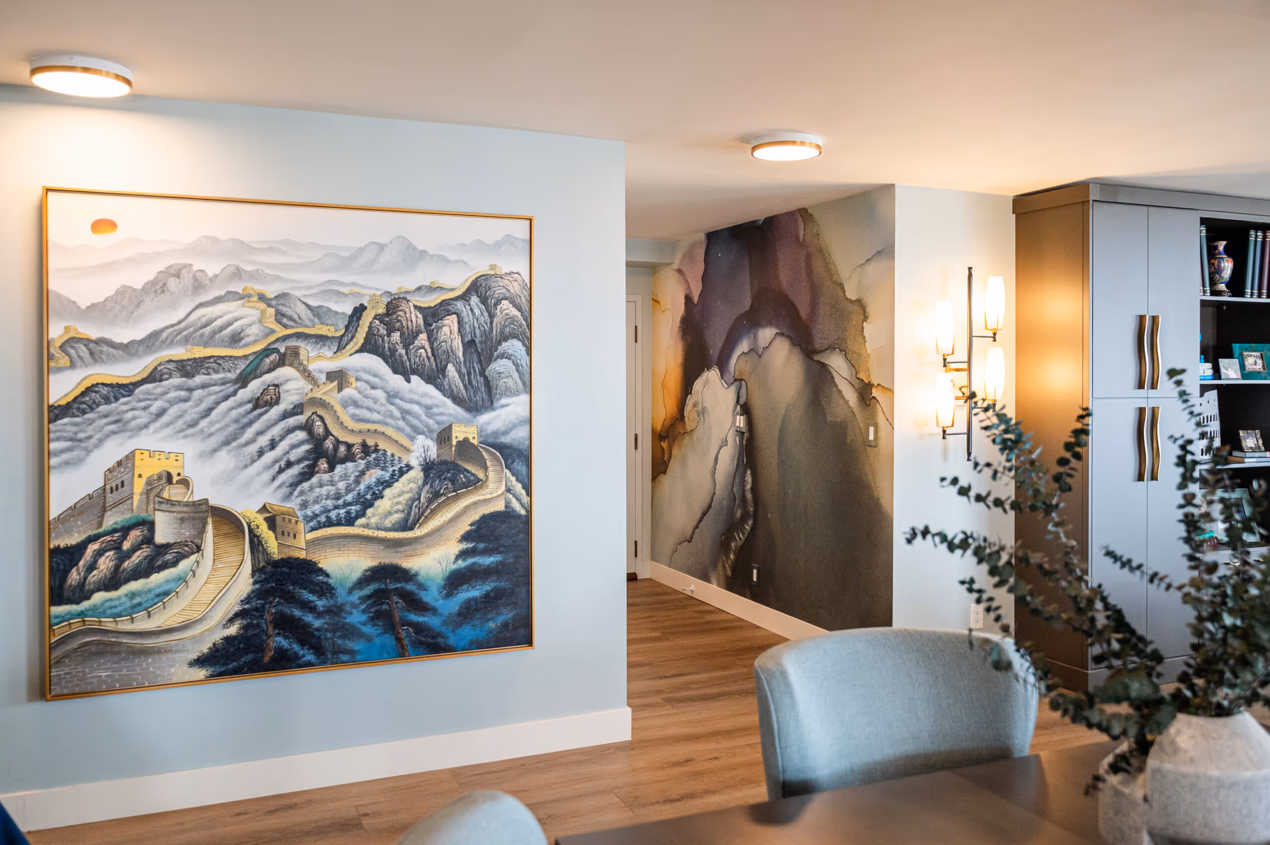 Downtown Denver condo living room with modern furnishings and abstract art wallpaper