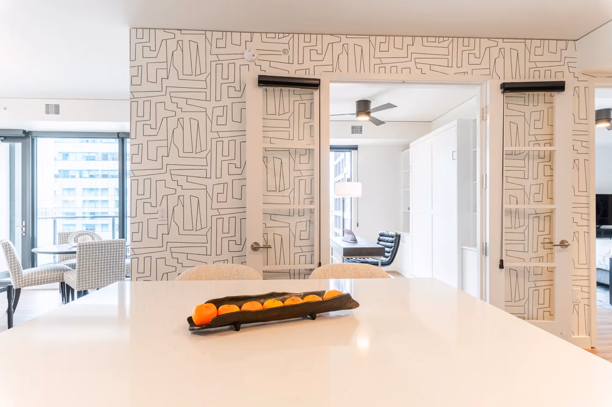 Living room in Denver condo remodel with abstract Thibault wallpaper