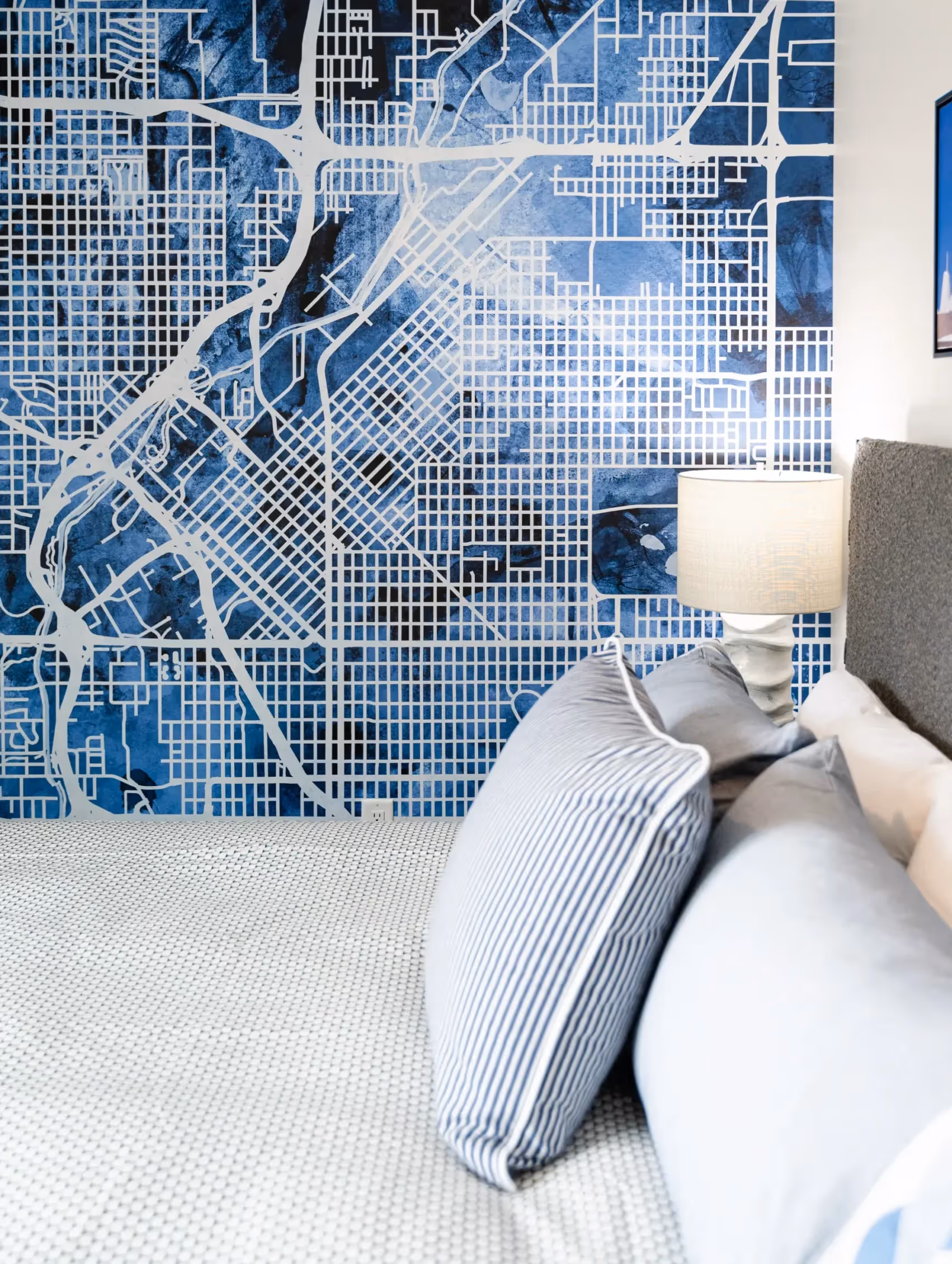 Guest bedroom featuring a bold Denver city map mural