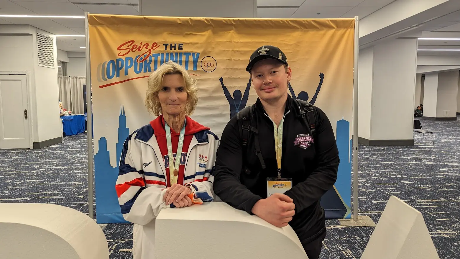 CTE director Jill Ranucci and Peter Polygalov at a BPA student organization conference, emphasizing the link between CTE pathways and career readiness.