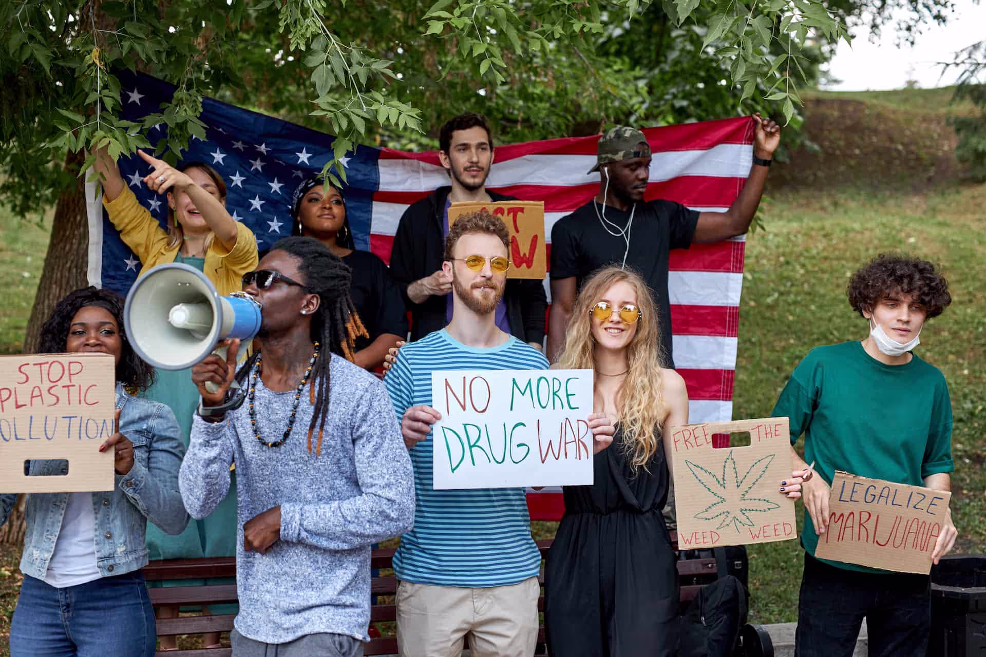 cannabis in massachusetts activists with usa flag and hand made signs supporting legalization of cannabis