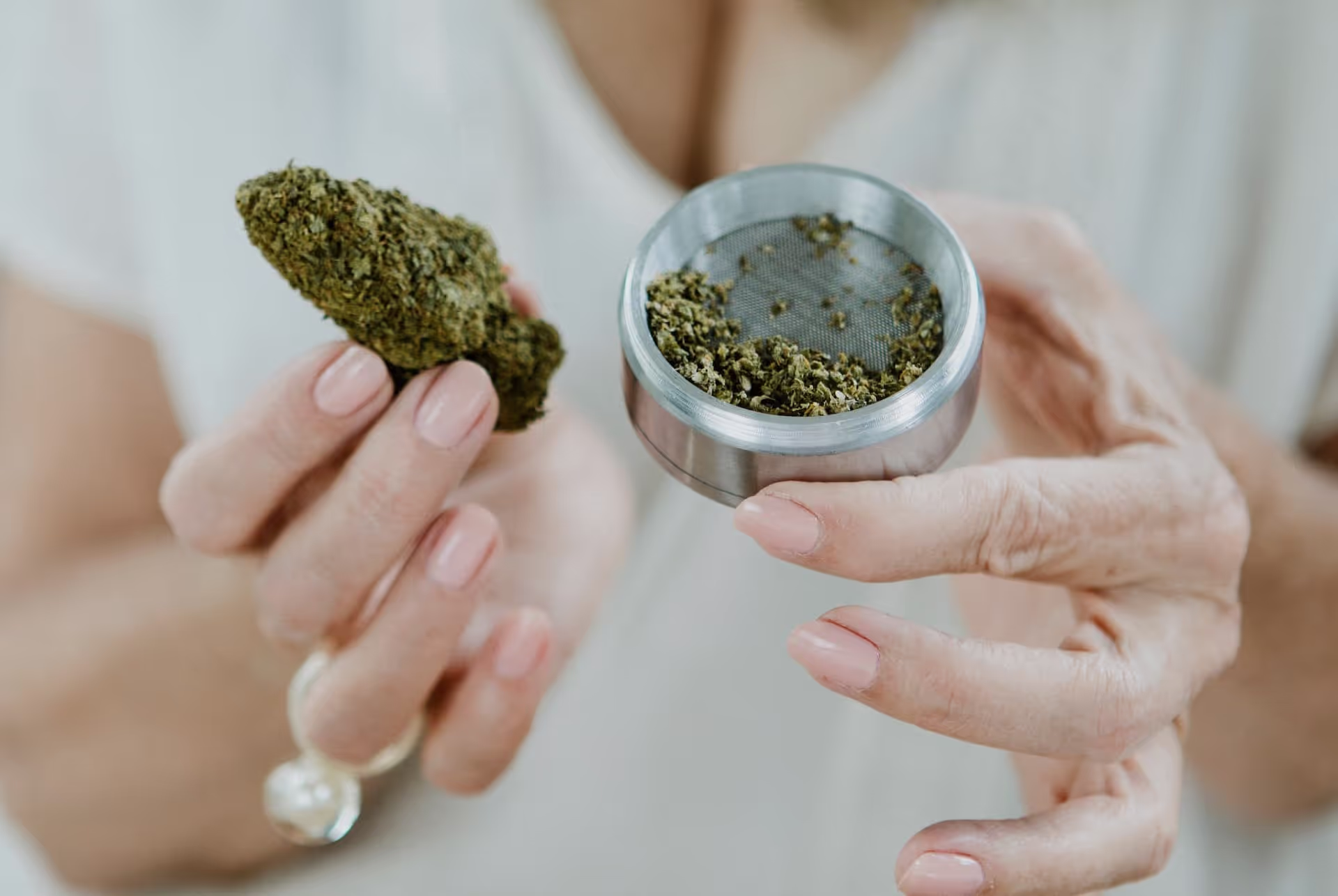 female hands holding weed in a recreational dispensary in swampscott