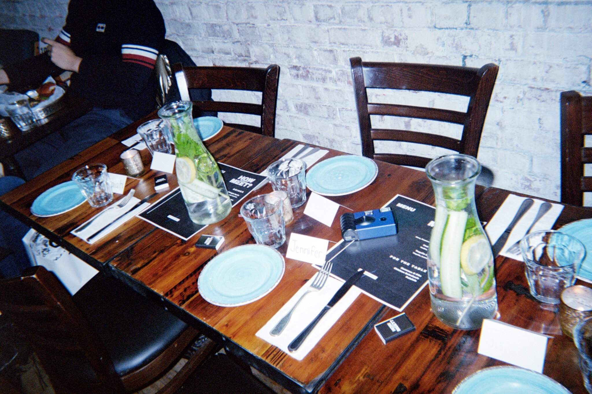 A How Jew Meet dinner table set with name cards and menus