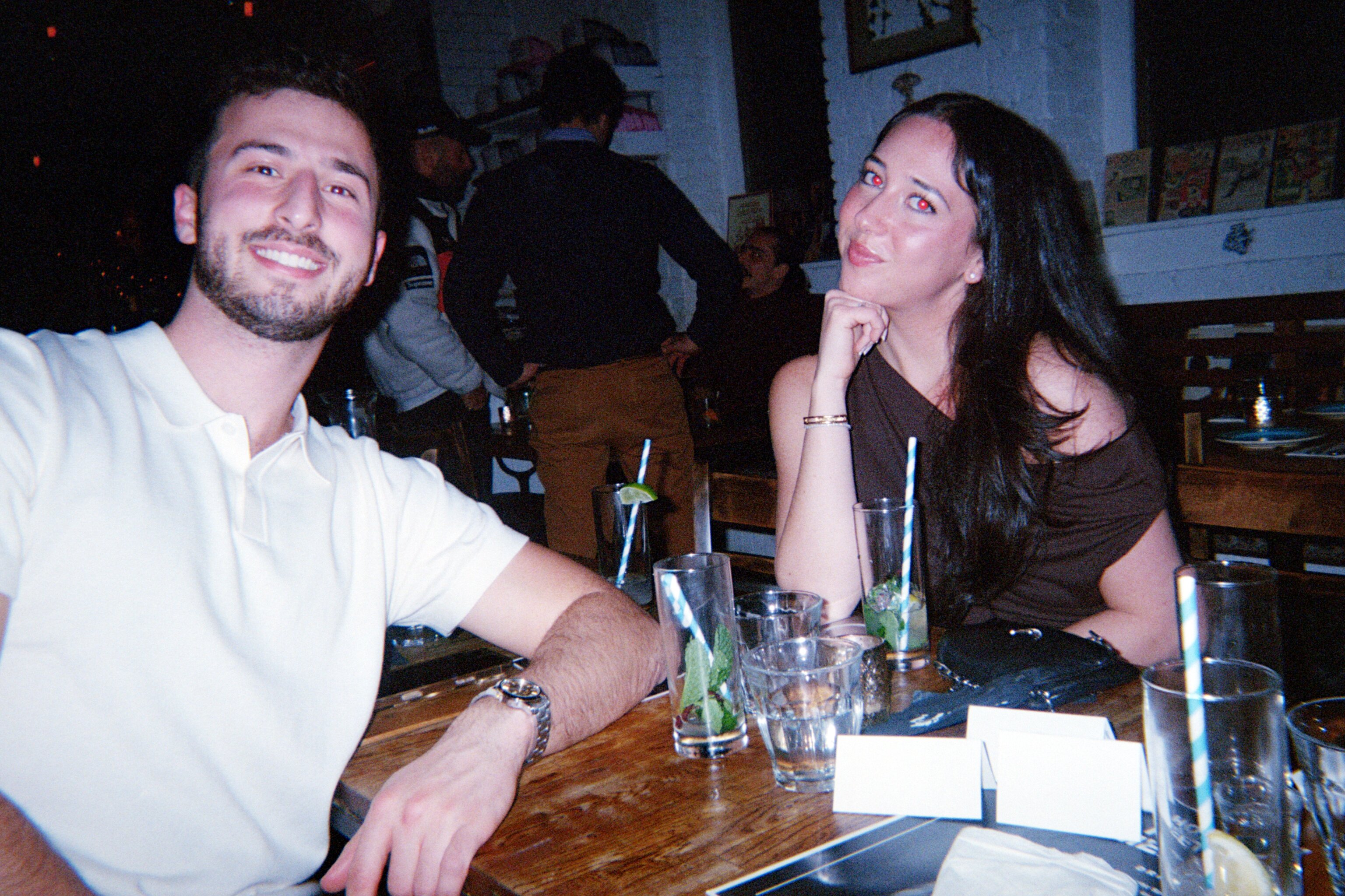 Two guests smiling at a How Jew Meet dinner