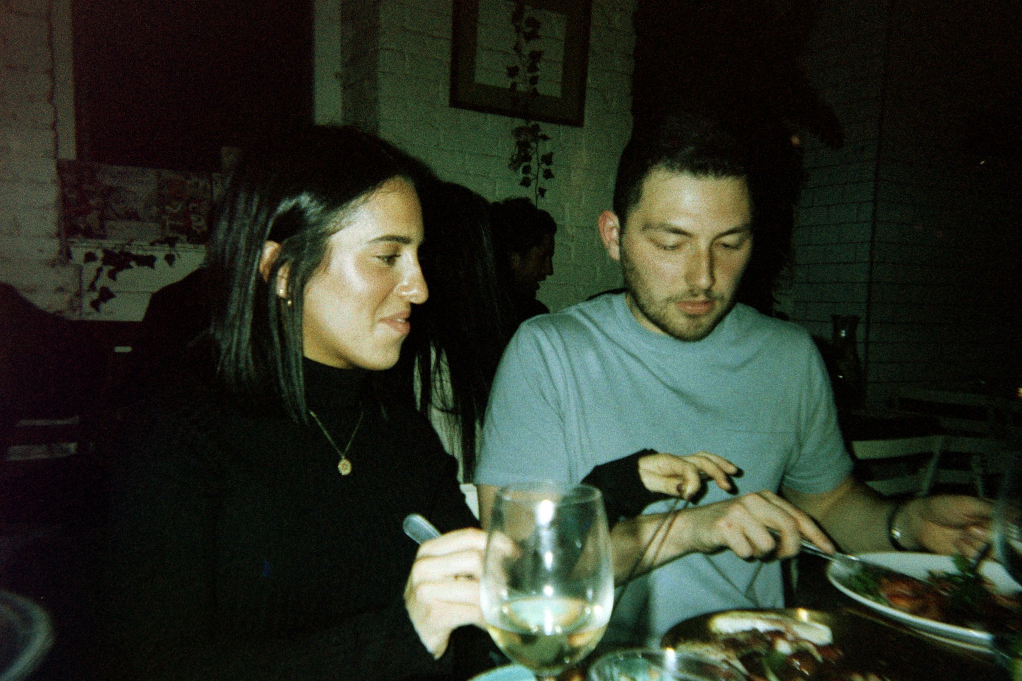 Two guests talking over dinner at a How Jew Meet table