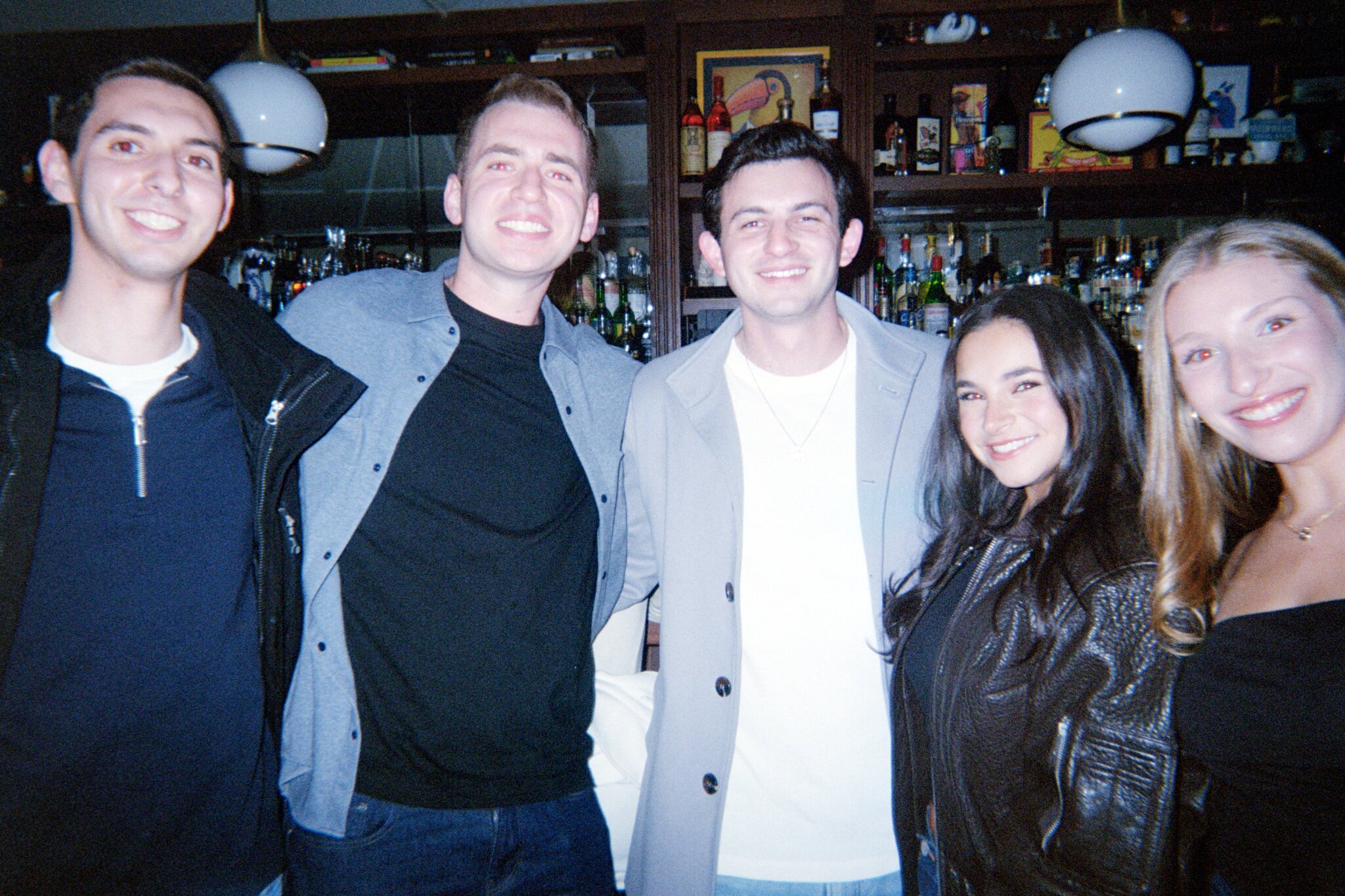 A group of friends together at the bar
