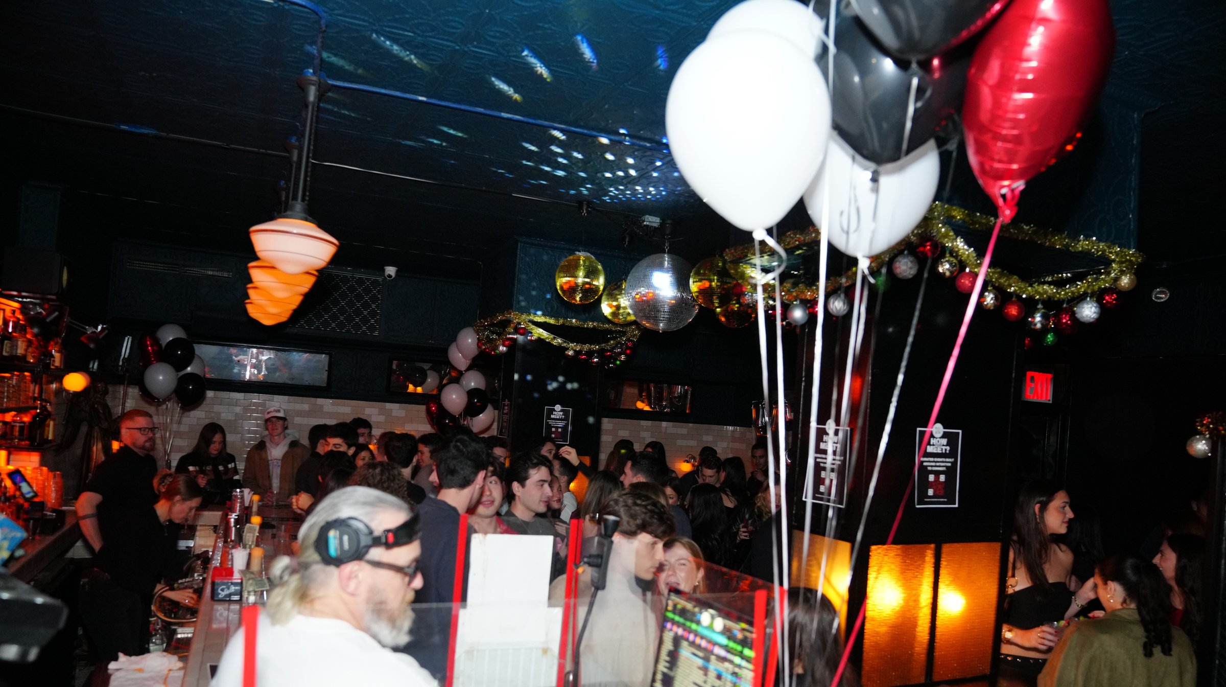 A DJ and a full bar at a How Jew Meet night out