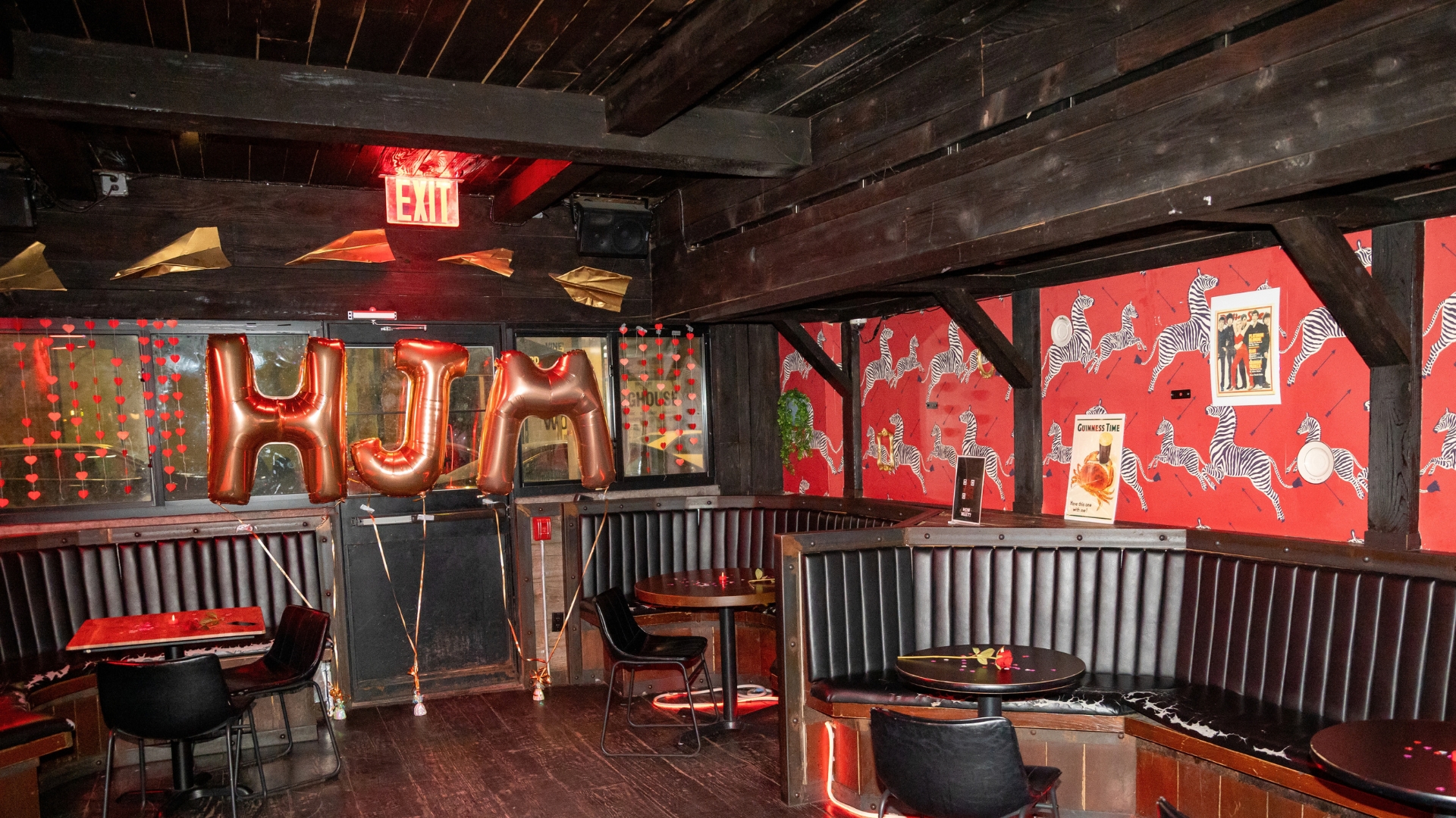 HJM balloon letters over a bar decked out for a How Jew Meet party