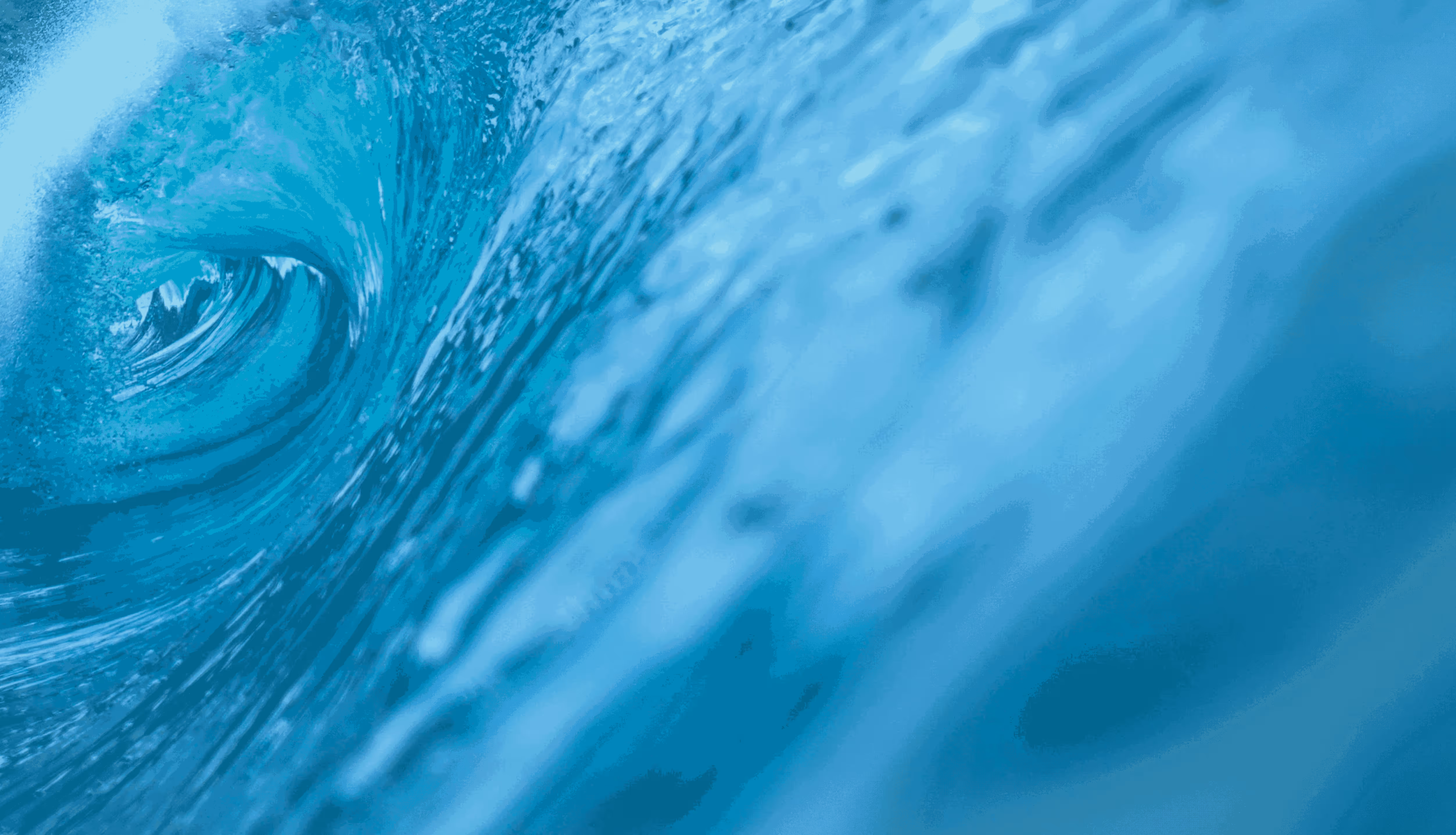 A close up of a wave in the ocean.