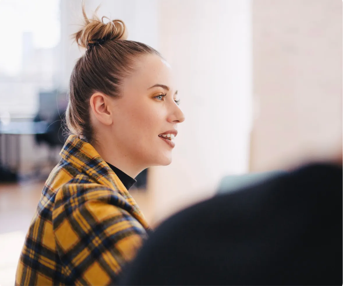 girl looking into distance in an office