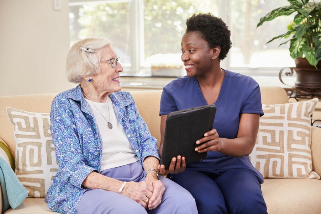 Staff Speaking With Senior at Vinson Hall Retirement Community, McLean