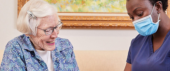 Home Care Staff Helping a Senior at Vinson Hall Retirement Community, McLean