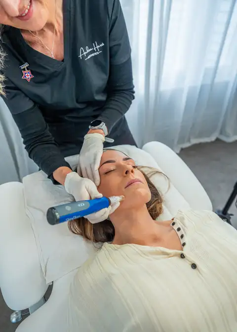 Andrea Harris performing a SkinPen microneedling treatment