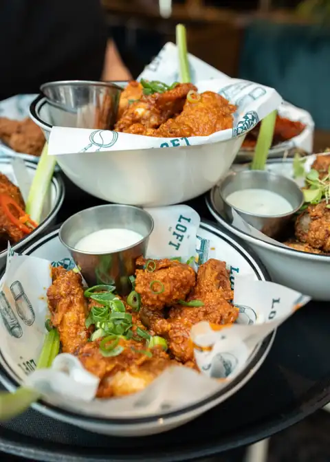 Buffalo wings with ranch dipping sauce at The Loft Bar