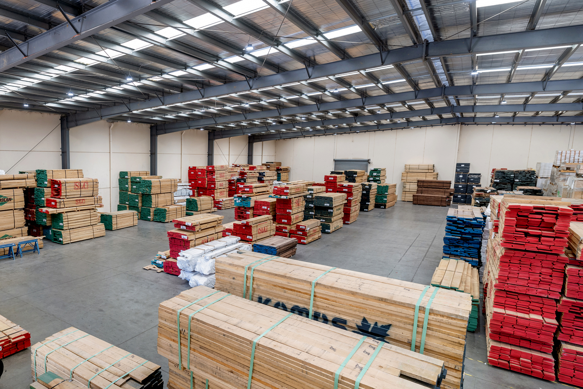 American Hardwoods factory interior stacked with various timber types