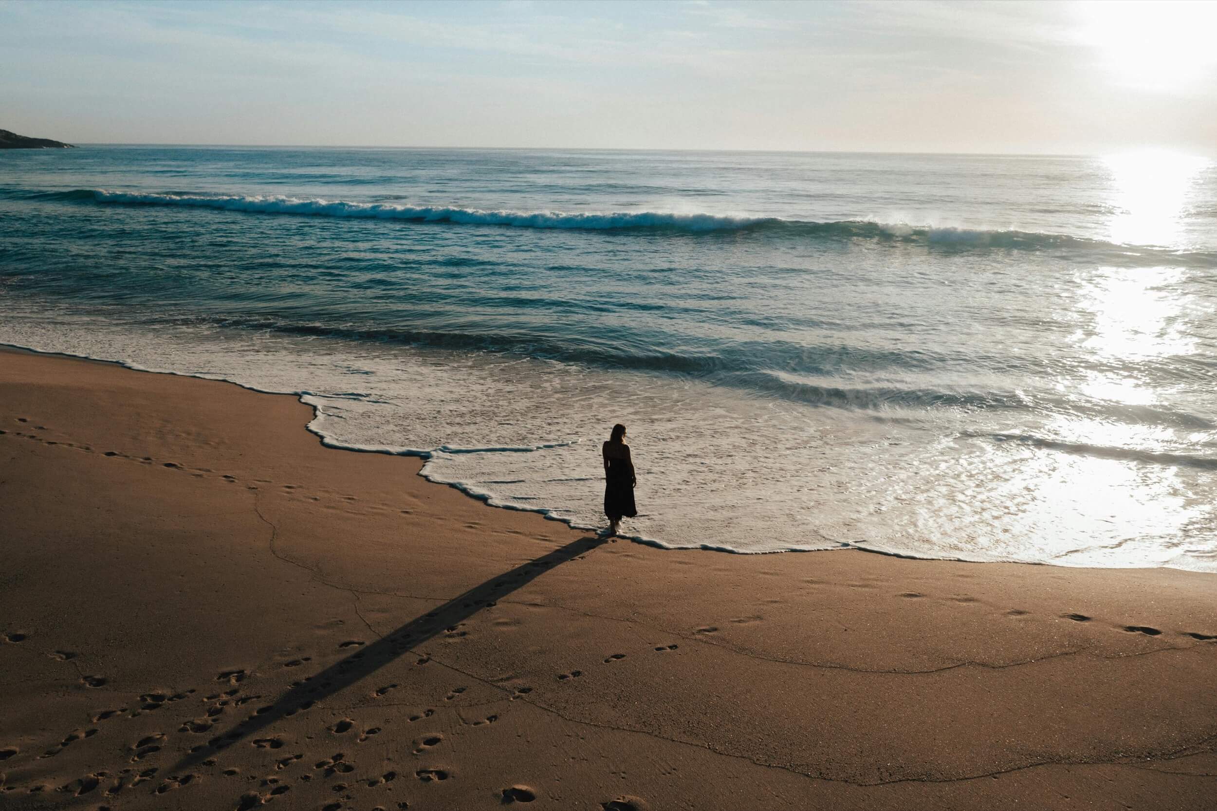 person walking on beach in sydney
