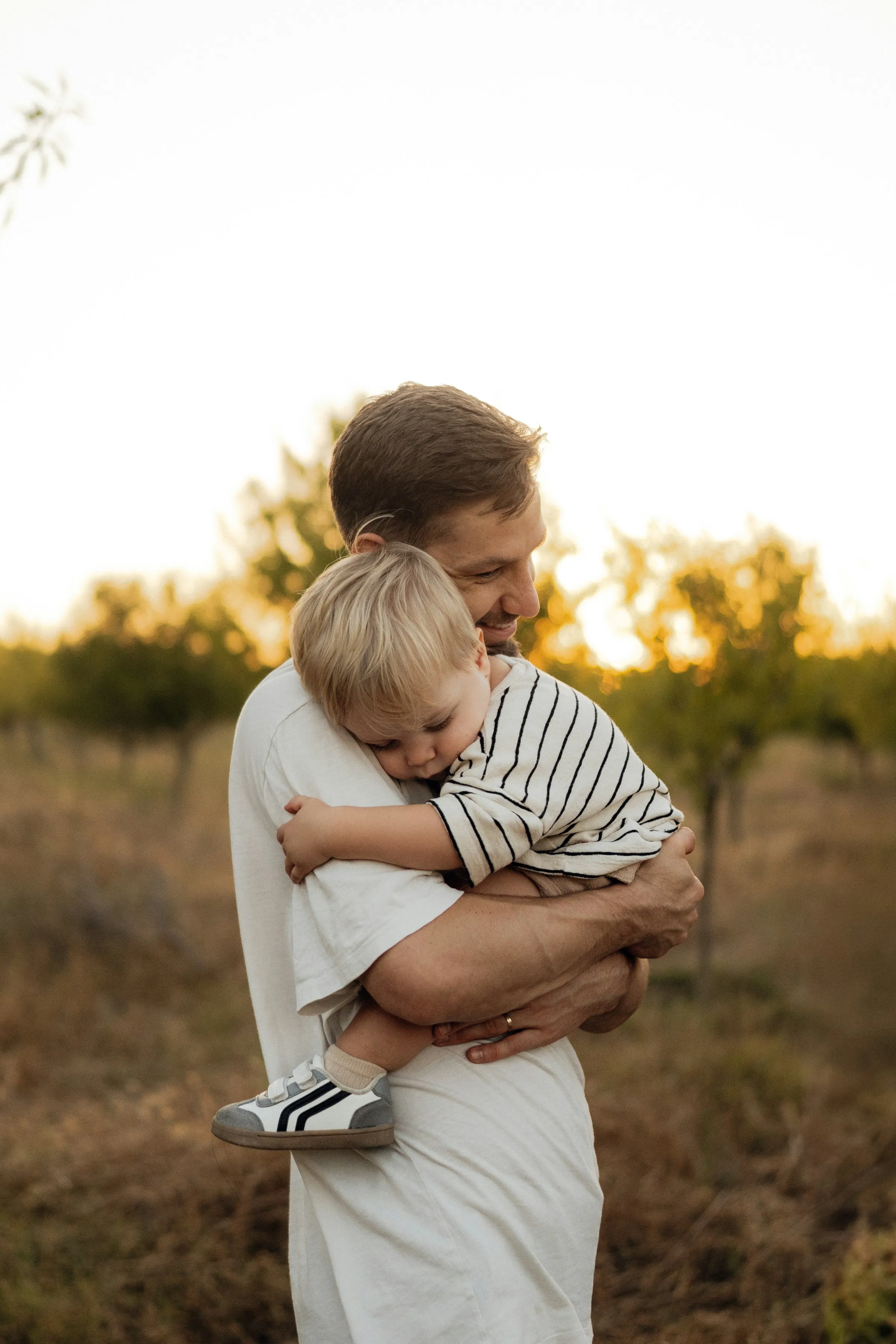 father and son smiling outdoors sydney endoview
