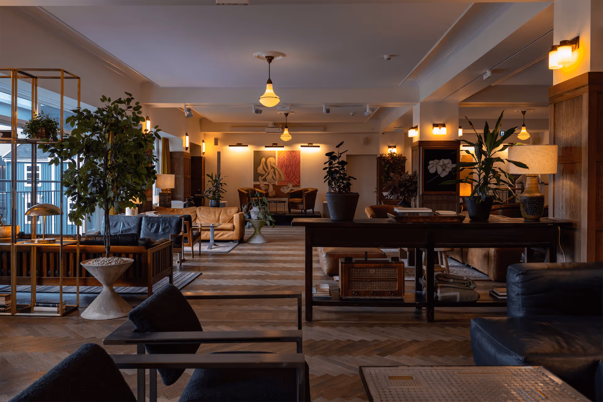 Multi-level lounge at Fantasia with contemporary artwork, vintage radio, and sophisticated mid-century design elements