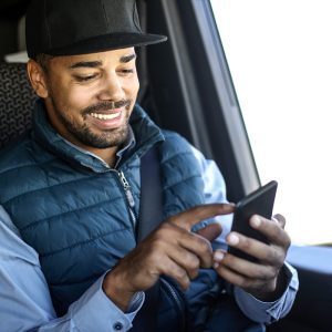 Truck Driver Managing His Business on His Phone