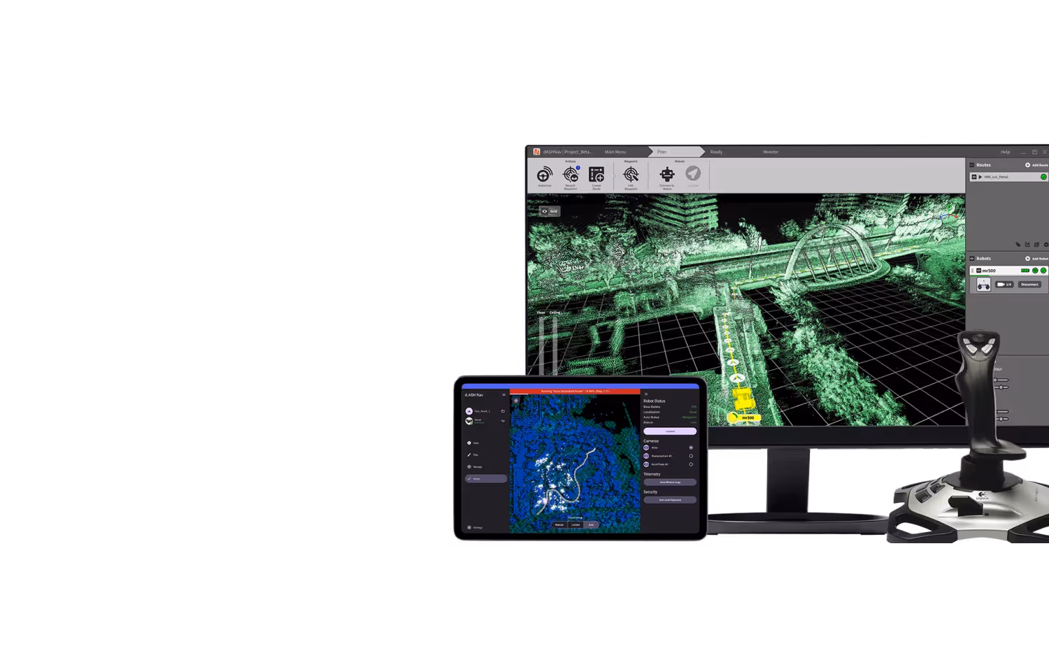 Computer monitor and tablet displaying 3D mapping and robot navigation interfaces, accompanied by a joystick controller.