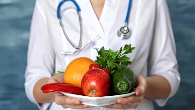 Clinical team planning medically tailored meals for a heart failure patient at discharge