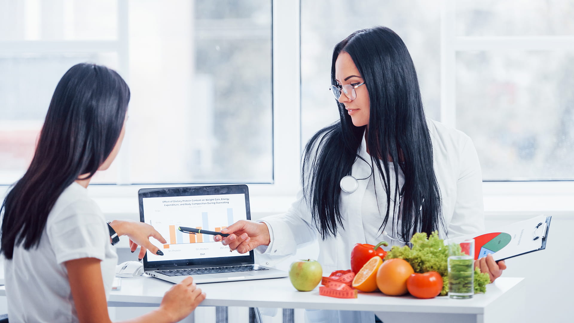 Multidisciplinary healthcare team reviewing nutrition workflows and patient care processes in a clinical setting