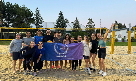 Students at a Beach Volleyball Field