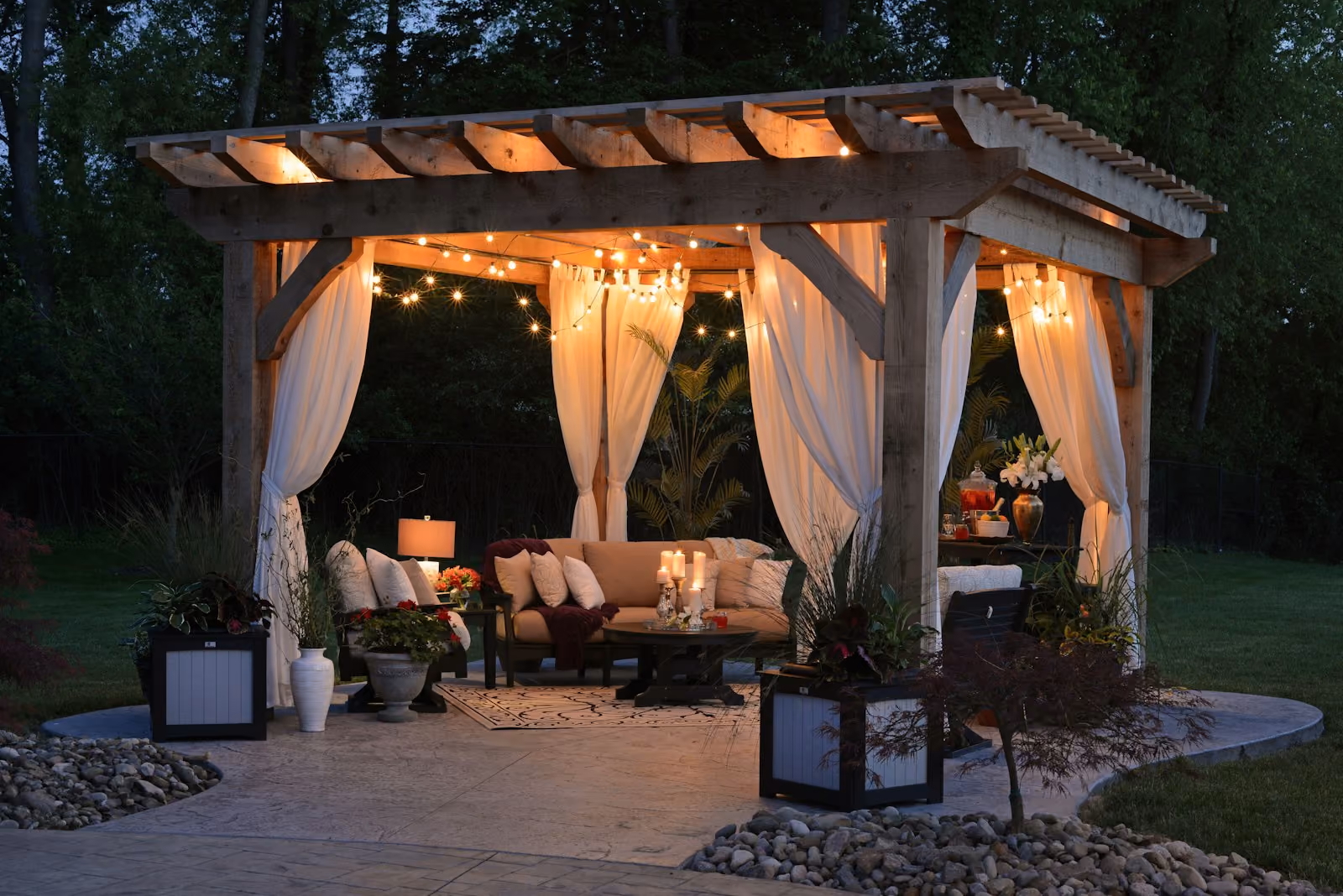 Backyard gazebo with curtains and string lights