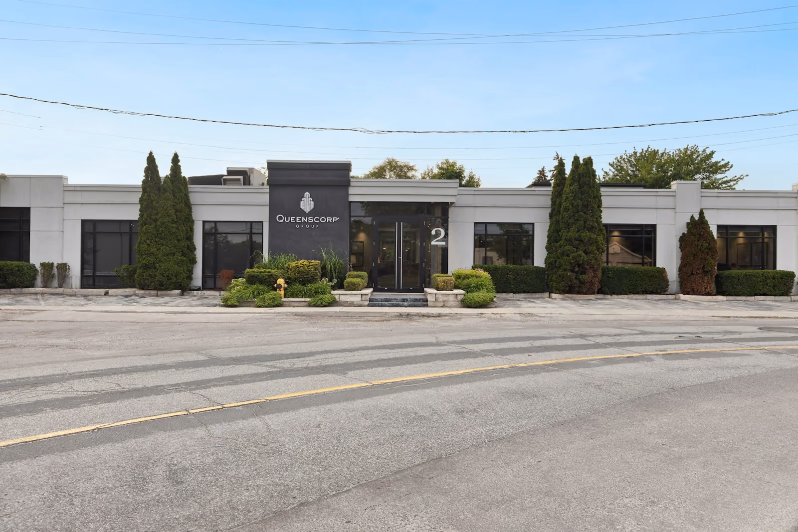 Commercial property building with trees and landscaping