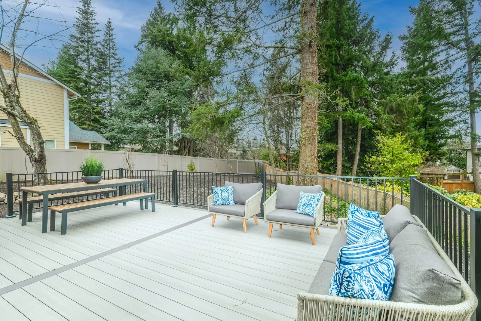 Wooden backyard deck with a bench