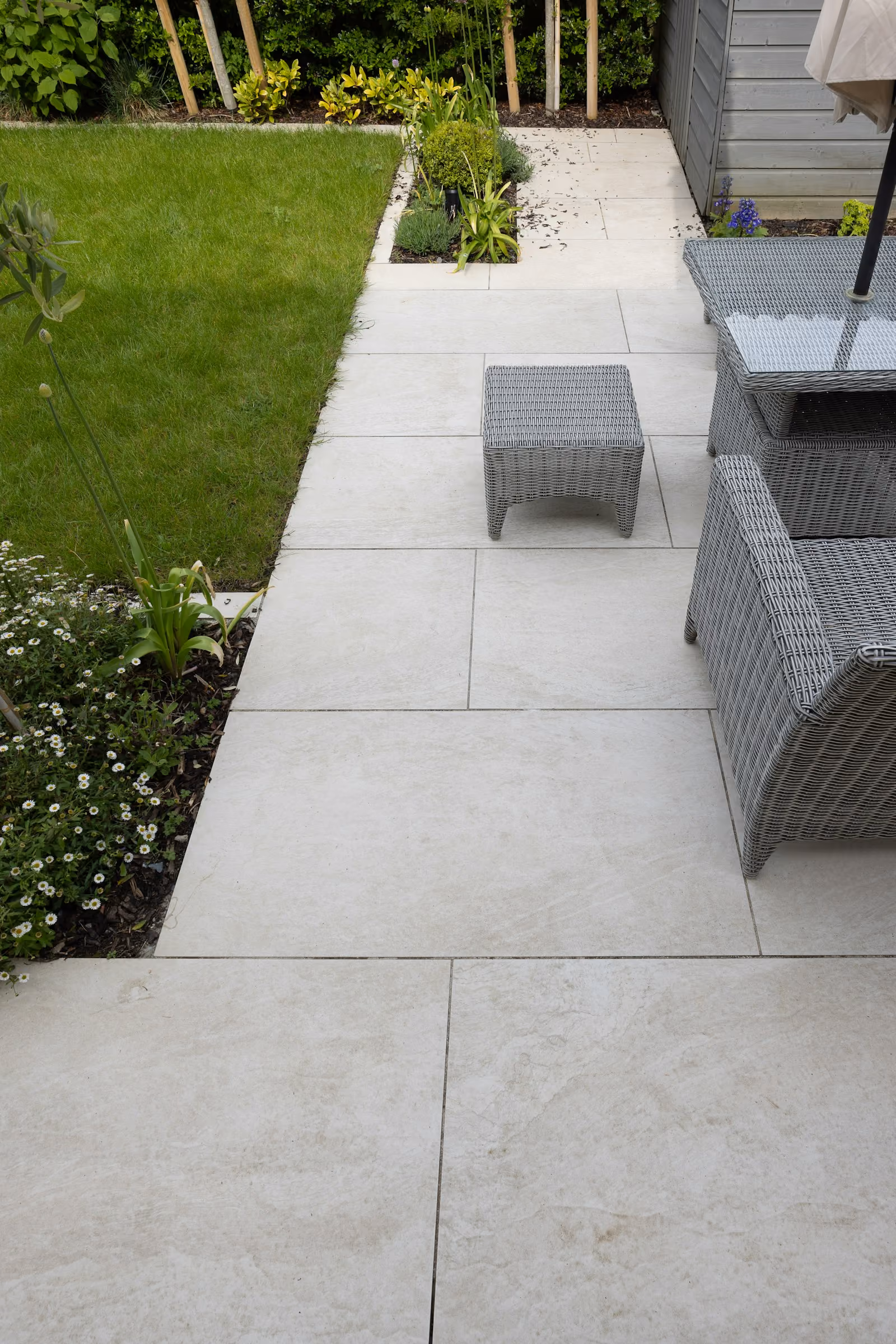 Backyard patio with a table, chairs and umbrella