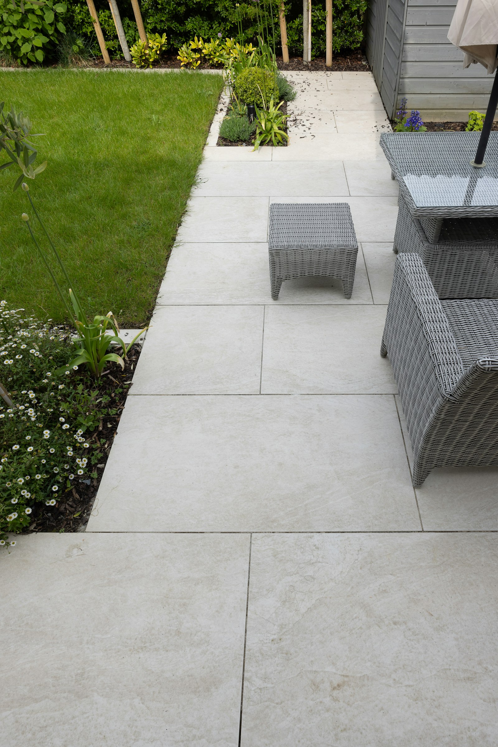 Backyard patio with a table, chairs and umbrella