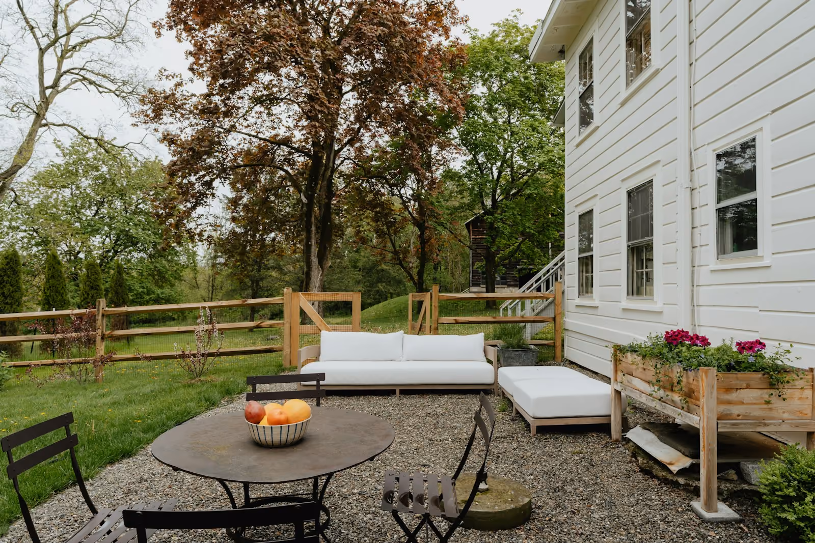 Backyard patio with seating and a couch
