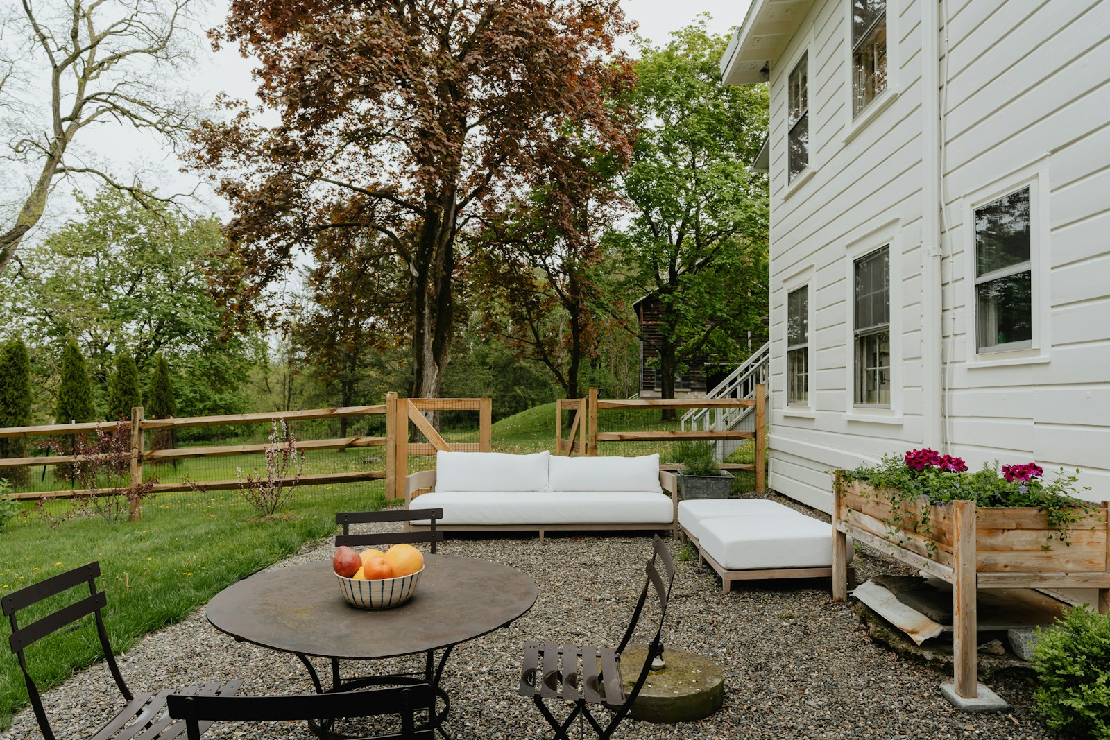 Backyard patio with seating and a couch