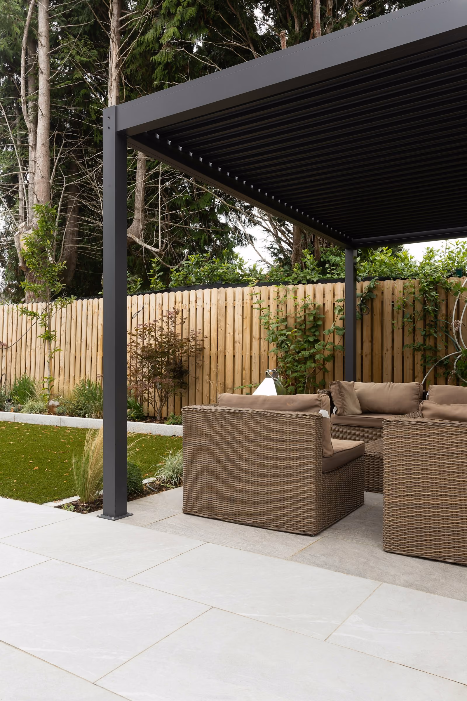 Covered patio with a couch and chairs