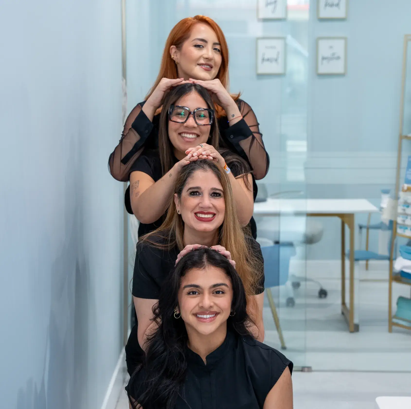A group of women standing next to each other.