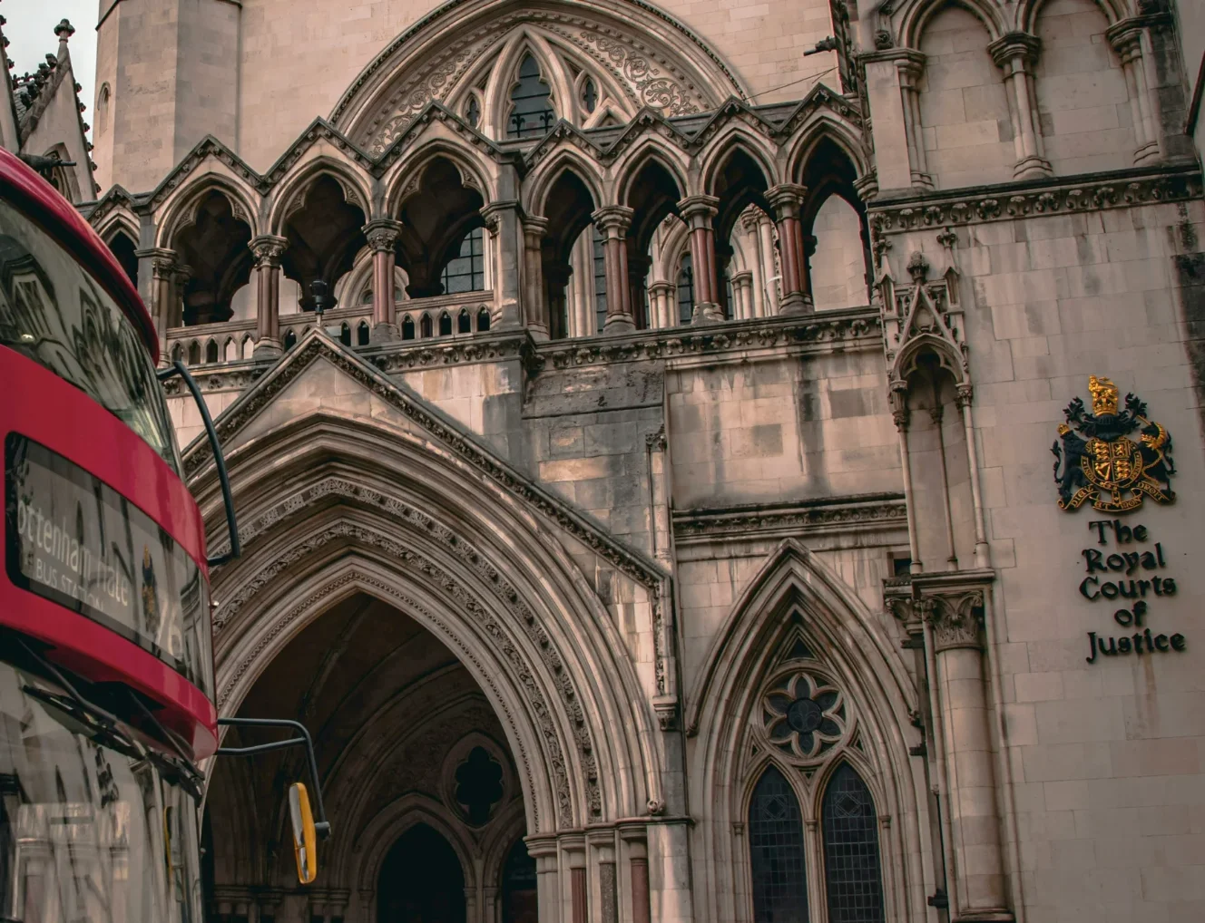The royal courts of justice building london - with london red bus going by
