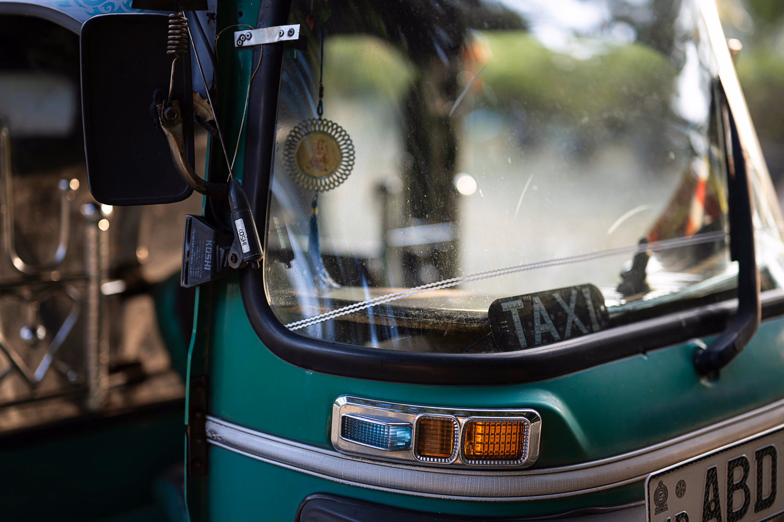 Green tuk-tuk taxi for transfers around Ahangama and Sri Lanka's South Coast