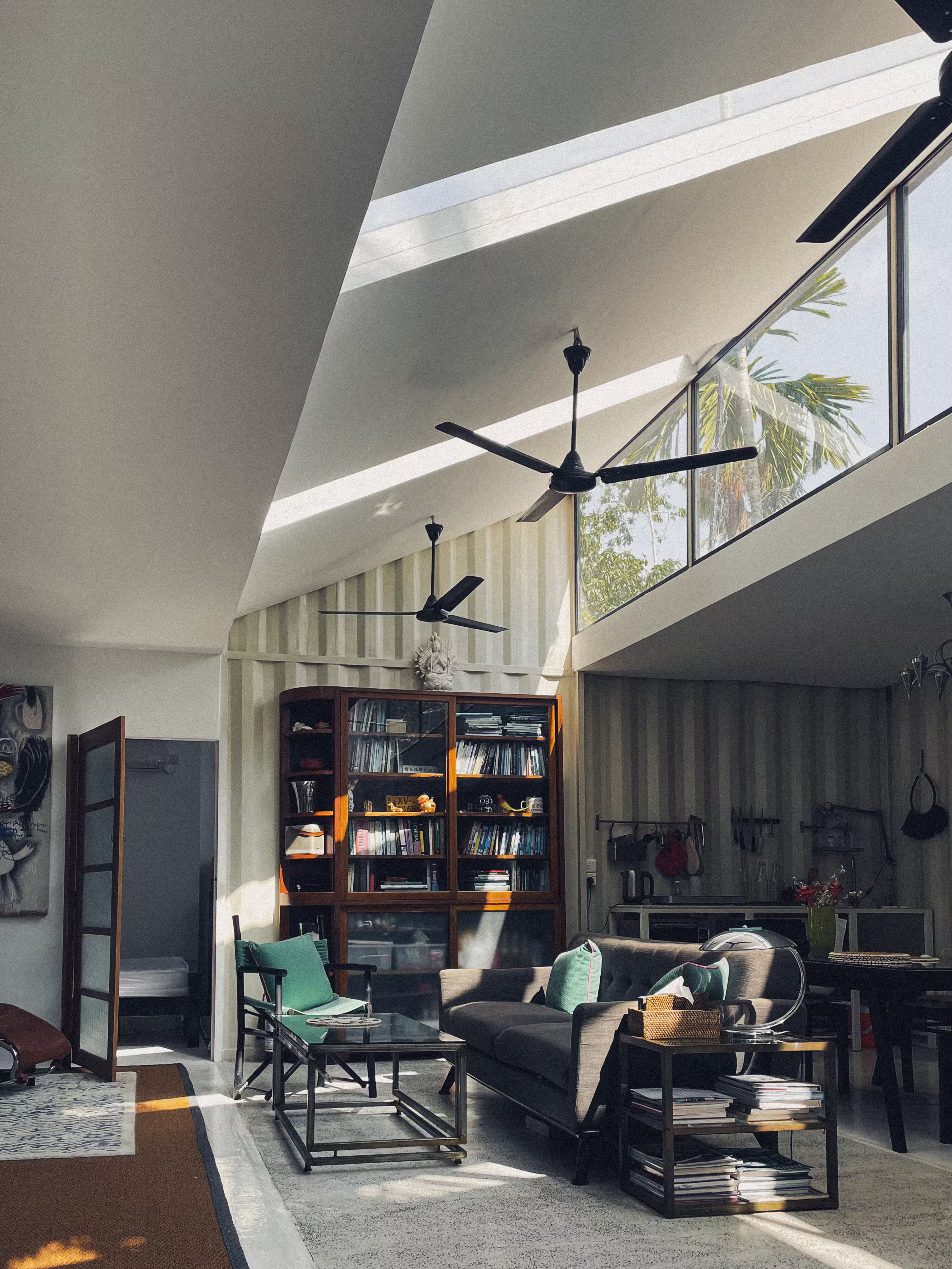 Outdoor sitting area surrounded by greenery and jungle views