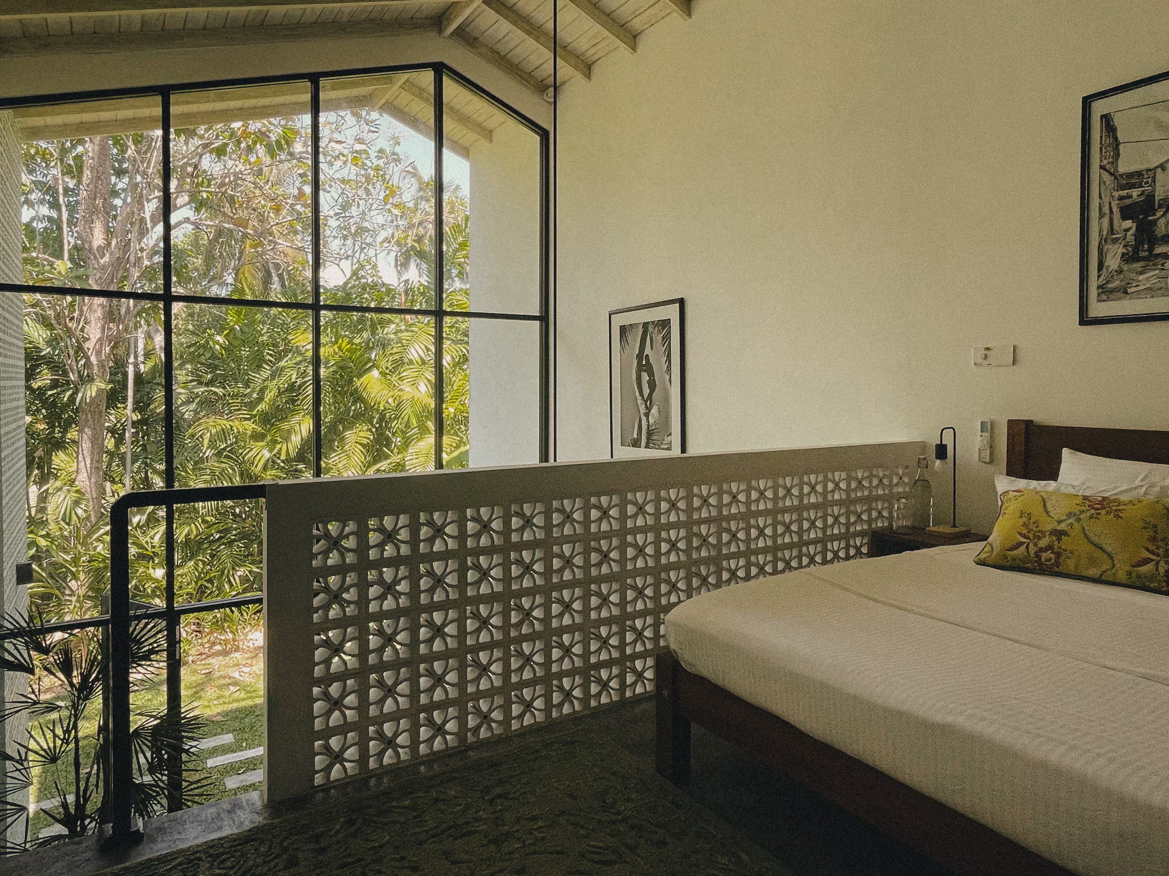 Tropical villa featuring a mezzanine bedroom with open, airy design