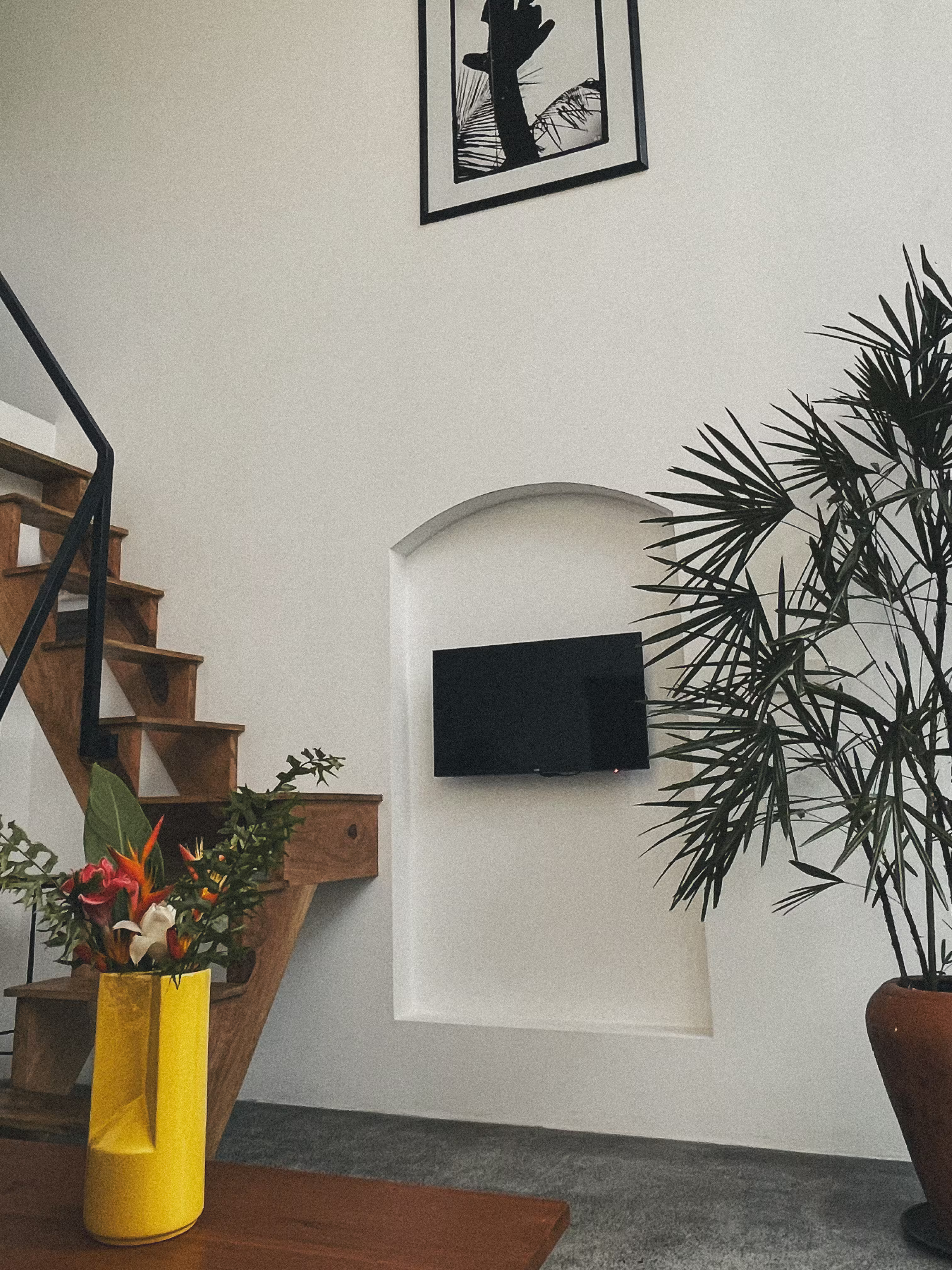 Modern indoor shower in a bright, minimalist tropical villa