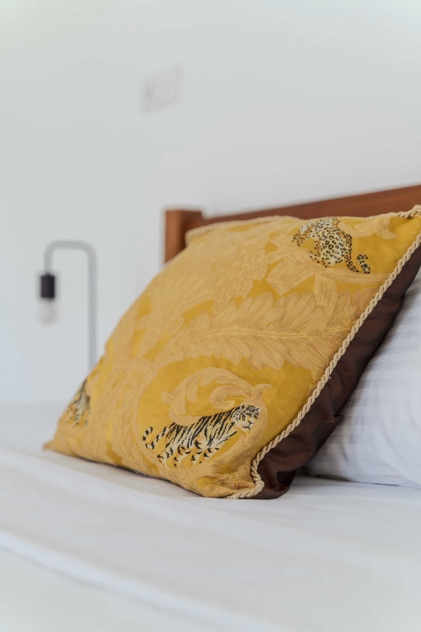 Tiger-print cushion detail on the king bed of the Garden House, Licuala Lanka near Kabalana Beach, Sri Lanka