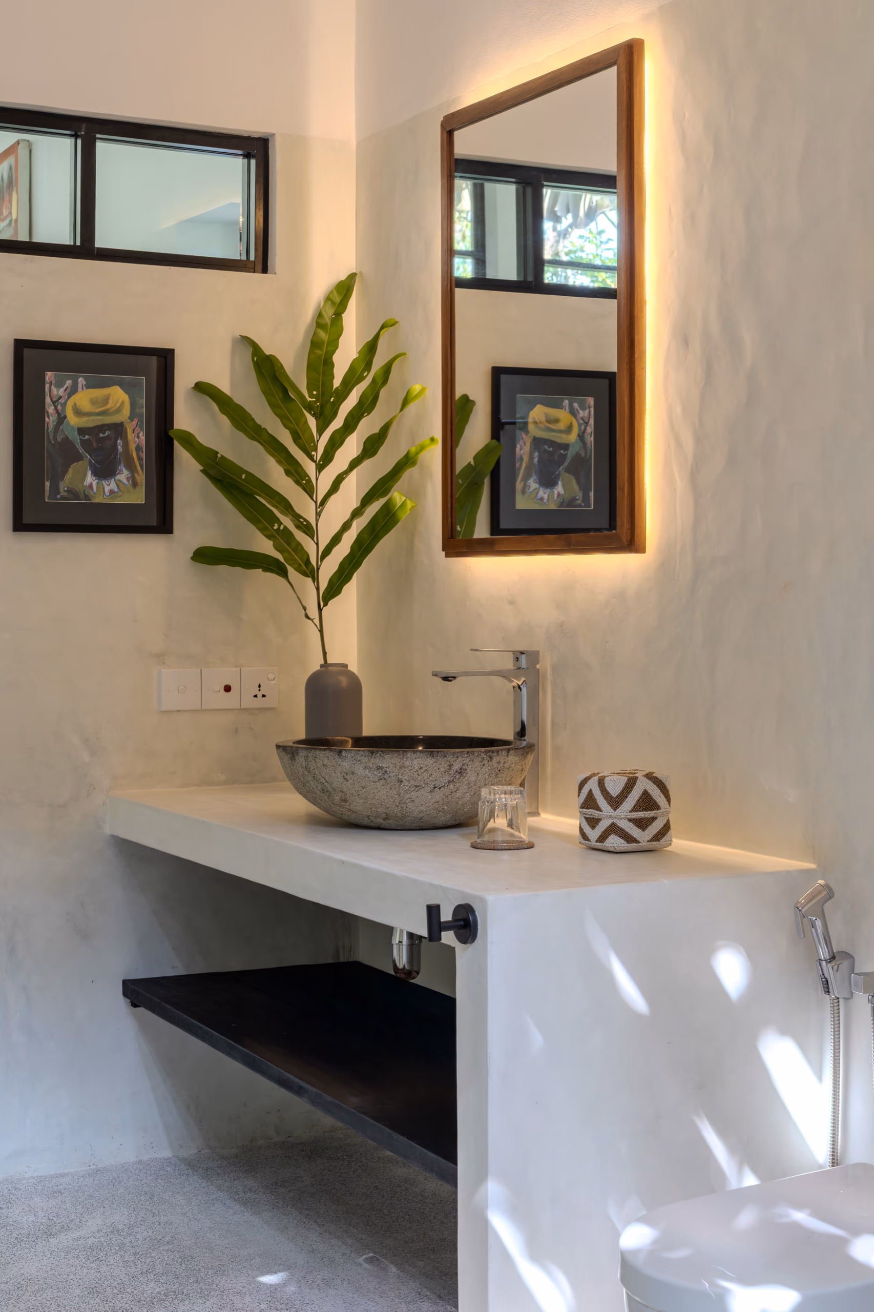 Concrete vanity with backlit mirror in the Garden House bathroom, Licuala Lanka, Ahangama, Sri Lanka