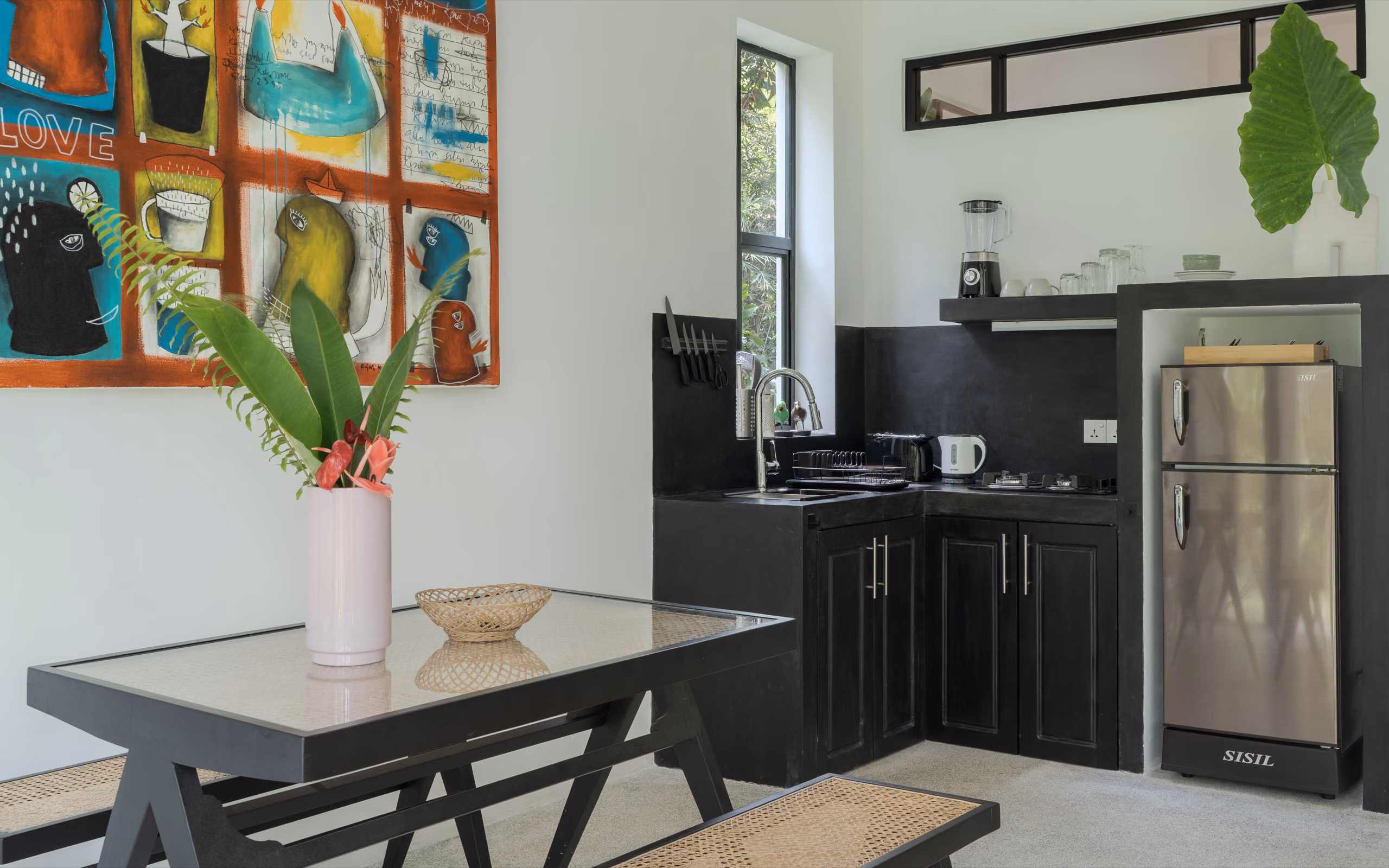 Equipped kitchen and dining table in the Garden House at Licuala Lanka near Kabalana Beach, Sri Lanka