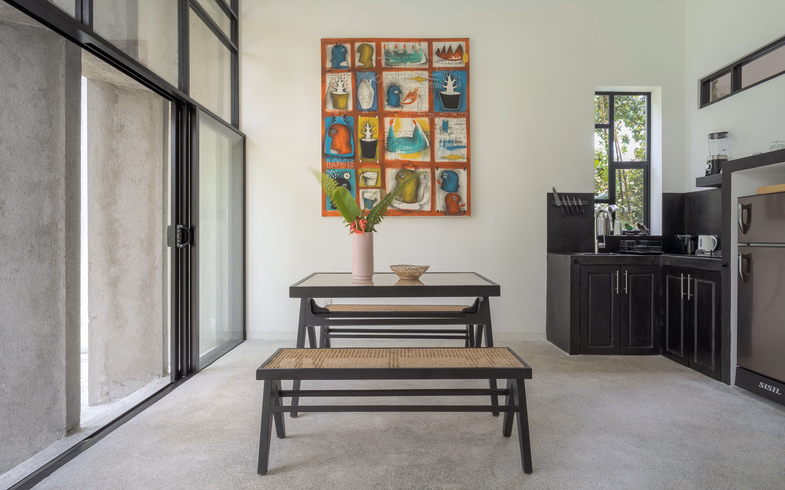 Kitchen with colorful artwork inside the Garden House at Licuala Lanka, Ahangama, Sri Lanka