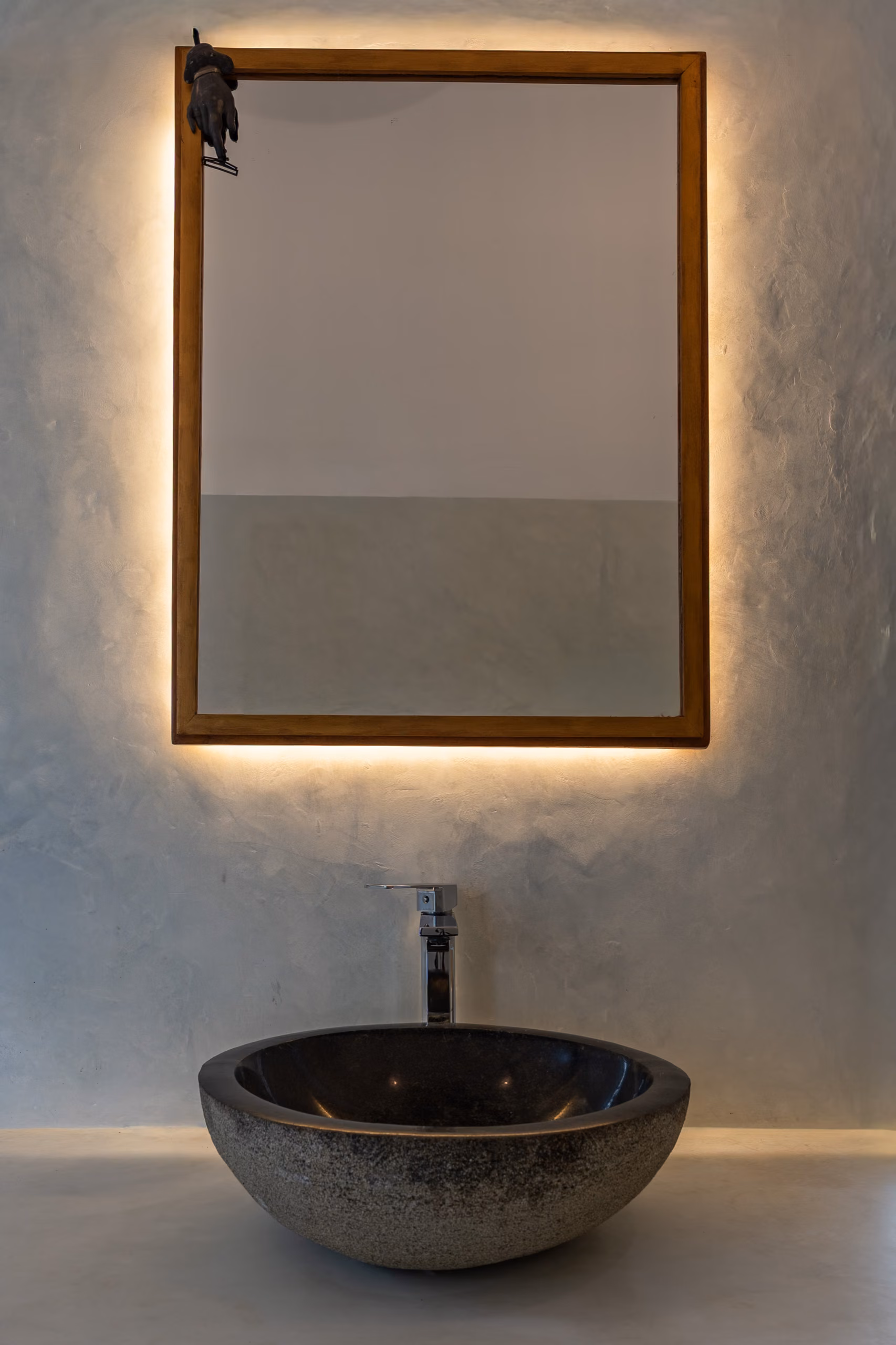 Backlit mirror and stone sink in the Pool Bungalow bathroom, Licuala Lanka, Ahangama, Sri Lanka