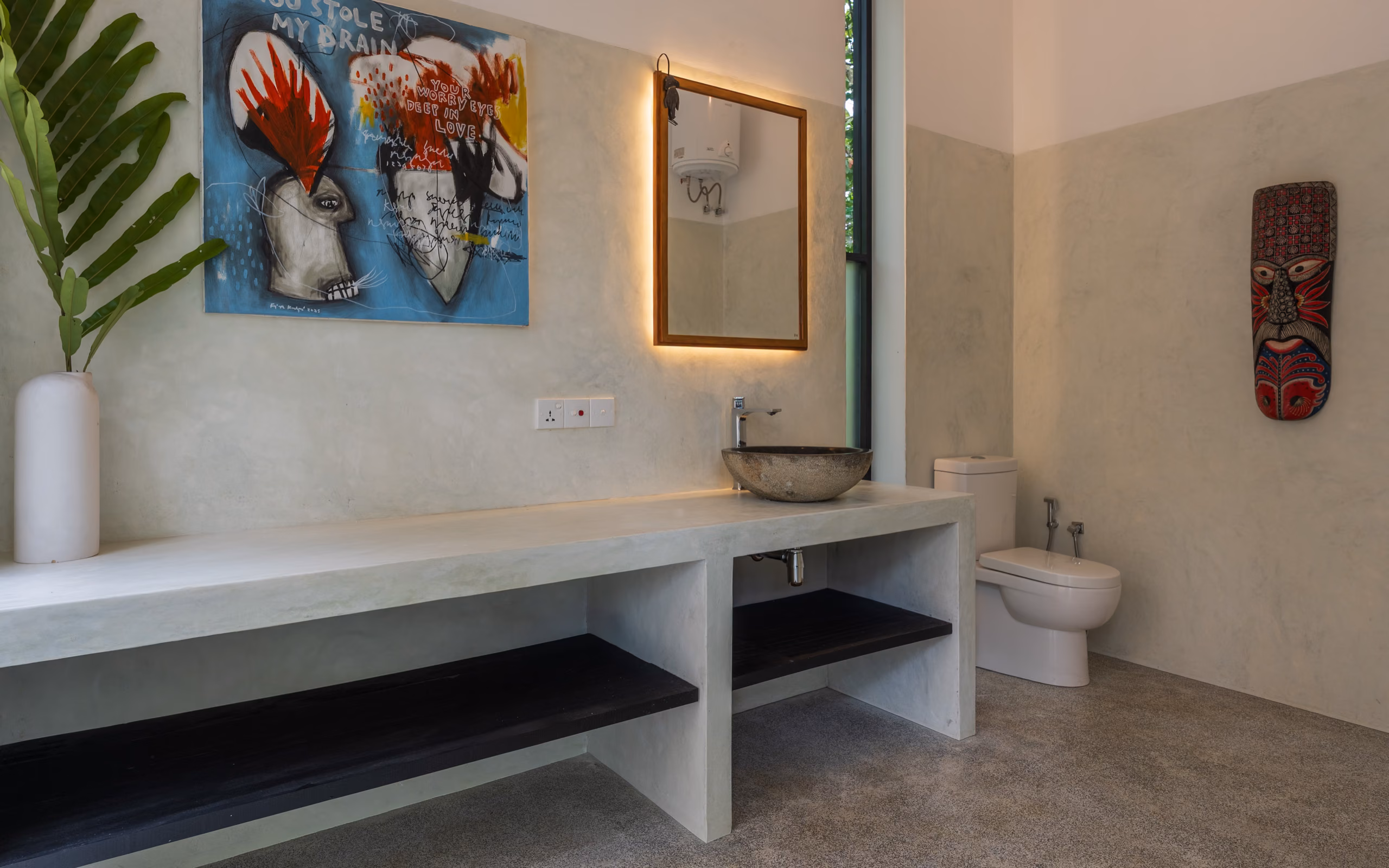 Concrete vanity and artwork in the Pool Bungalow bathroom, Licuala Lanka on Sri Lanka's South Coast