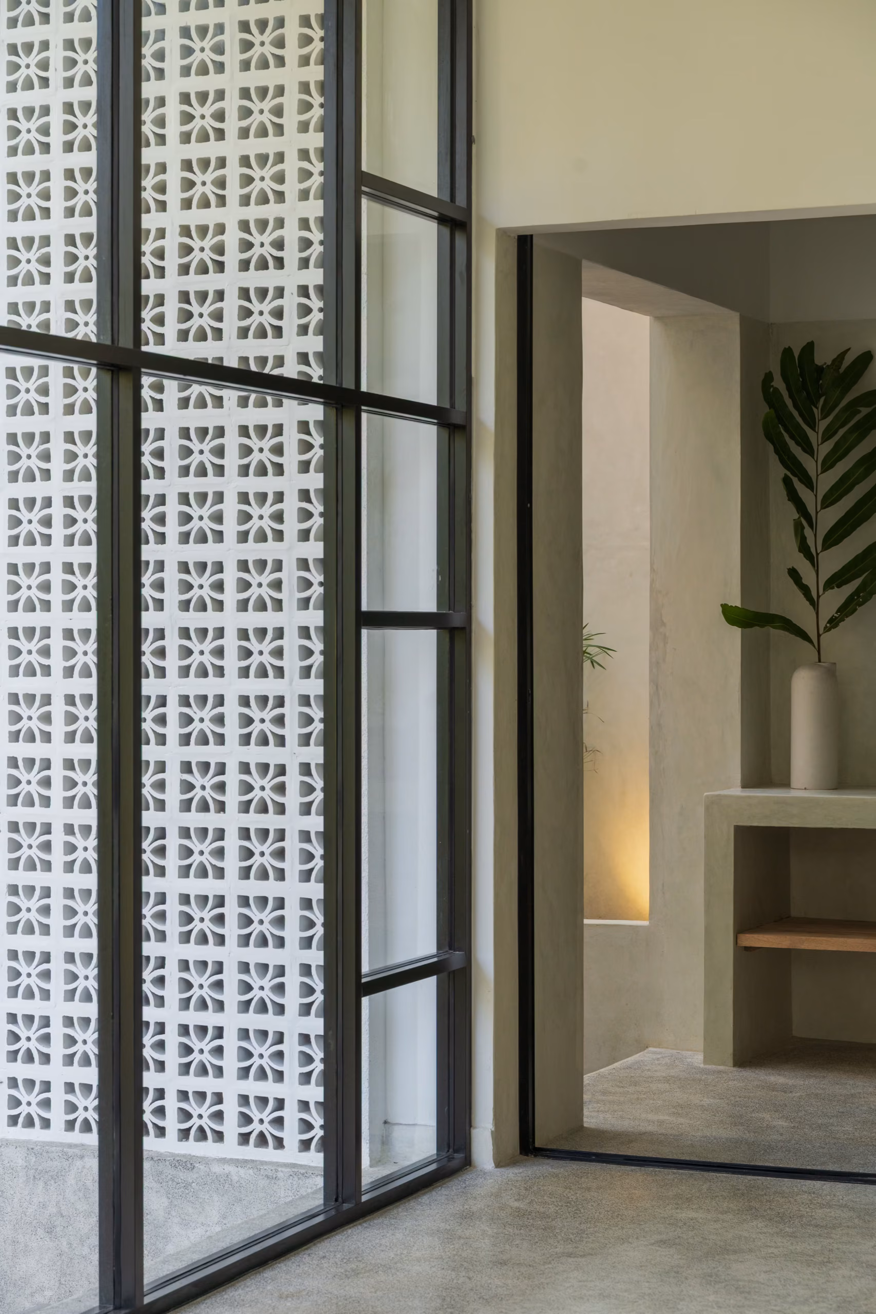 Breeze-block wall and glass entry of the Pool Bungalow at Licuala Lanka, Ahangama, Sri Lanka